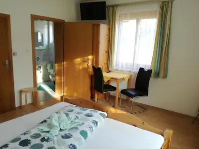 Ein Bett oder Betten in einem Zimmer der Unterkunft Lasserhof