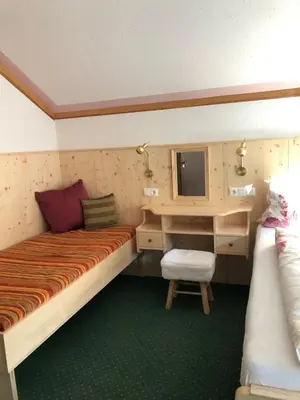 Ein Bett oder Betten in einem Zimmer der Unterkunft Waldhaus