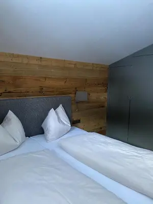 Ein Bett oder Betten in einem Zimmer der Unterkunft Dr. Aufmesser Appartements
