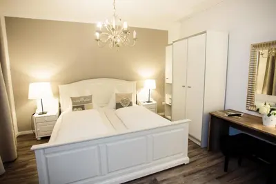 Ein Bett oder Betten in einem Zimmer der Unterkunft Märchenwald Steiermark Gasthof Sonnenhof