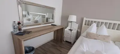 Ein Bett oder Betten in einem Zimmer der Unterkunft Märchenwald Steiermark Gasthof Sonnenhof