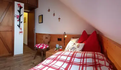 Ein Bett oder Betten in einem Zimmer der Unterkunft Katschberghöhe 21