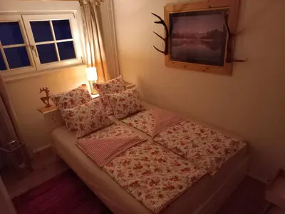 Ein Bett oder Betten in einem Zimmer der Unterkunft Apartment Almröserl Edelweiss