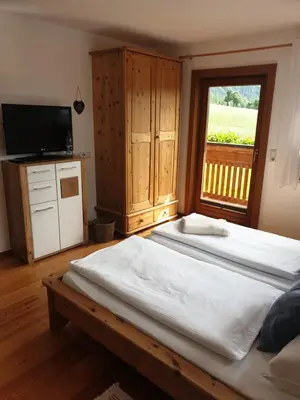 Ein Bett oder Betten in einem Zimmer der Unterkunft Bergführerhaus