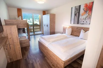 Ein Bett oder Betten in einem Zimmer der Unterkunft COOEE alpin Hotel Dachstein