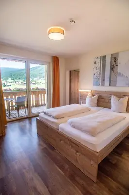 Ein Bett oder Betten in einem Zimmer der Unterkunft COOEE alpin Hotel Dachstein