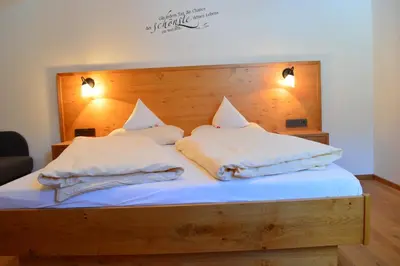 Ein Bett oder Betten in einem Zimmer der Unterkunft Filzerlehen
