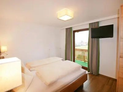 Ein Bett oder Betten in einem Zimmer der Unterkunft Holiday Home Happy by Interhome
