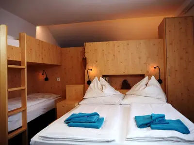 Ein Bett oder Betten in einem Zimmer der Unterkunft DAV-Haus (Alpenverein)
