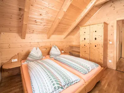 Ein Bett oder Betten in einem Zimmer der Unterkunft Chalet Fredis Hütte by Interhome