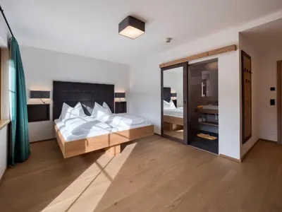Ein Bett oder Betten in einem Zimmer der Unterkunft Hotel Matschner
