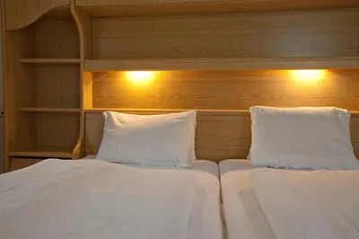 Ein Bett oder Betten in einem Zimmer der Unterkunft Gasthof Jaegerwirt