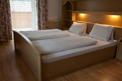 Ein Bett oder Betten in einem Zimmer der Unterkunft Gasthof Jaegerwirt