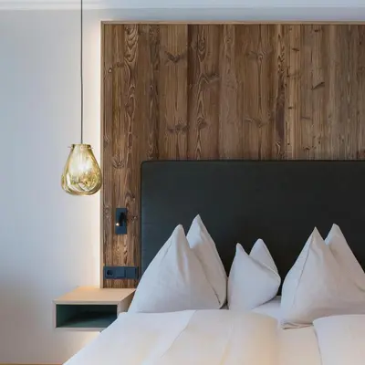 Ein Bett oder Betten in einem Zimmer der Unterkunft Wellnesshotel Eggerwirt