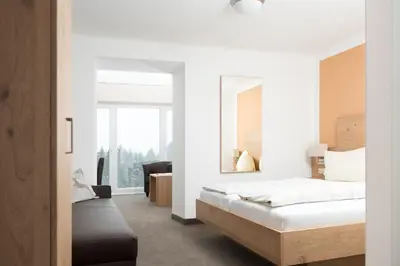 Ein Bett oder Betten in einem Zimmer der Unterkunft Pension Irlingerhof