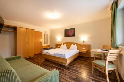 Ein Bett oder Betten in einem Zimmer der Unterkunft Hotel Hubertus