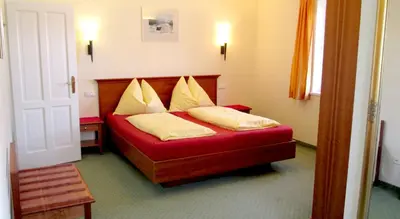Ein Bett oder Betten in einem Zimmer der Unterkunft Landhaus Leitner am Wolfgangsee