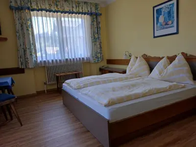 Ein Bett oder Betten in einem Zimmer der Unterkunft B&B Goldener Stern