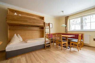 Ein Bett oder Betten in einem Zimmer der Unterkunft Hubertus Alpine Living