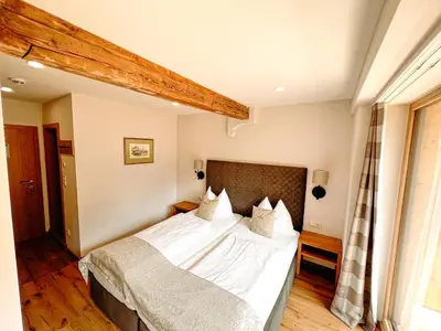 Ein Bett oder Betten in einem Zimmer der Unterkunft Hotel Pass Lueg