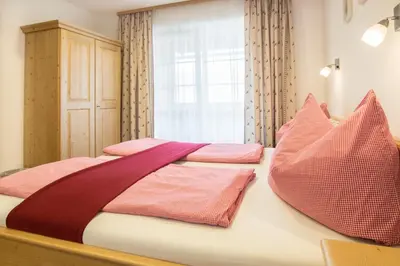 Ein Bett oder Betten in einem Zimmer der Unterkunft Ferienhof HINTERSTRASSER