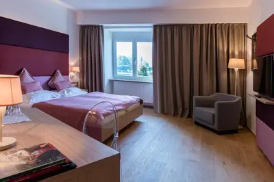 Ein Bett oder Betten in einem Zimmer der Unterkunft Seehotel Schwan
