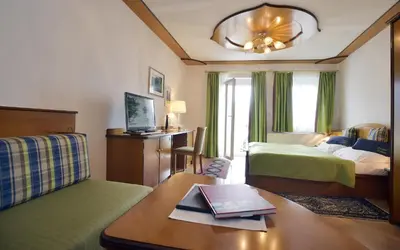 Ein Bett oder Betten in einem Zimmer der Unterkunft Seehotel Schwan