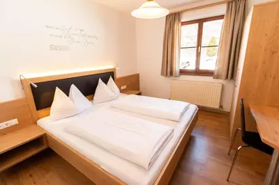 Ein Bett oder Betten in einem Zimmer der Unterkunft Landhotel - Apartments Bauer