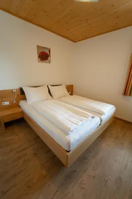Ein Bett oder Betten in einem Zimmer der Unterkunft Landhotel - Apartments Bauer