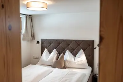 Ein Bett oder Betten in einem Zimmer der Unterkunft Obersulzberggut