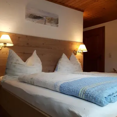 Ein Bett oder Betten in einem Zimmer der Unterkunft Ferienhaus Hintersee