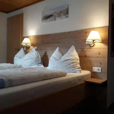 Ein Bett oder Betten in einem Zimmer der Unterkunft Ferienhaus Hintersee