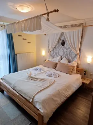 Ein Bett oder Betten in einem Zimmer der Unterkunft Berggasthof Schwaigerhof