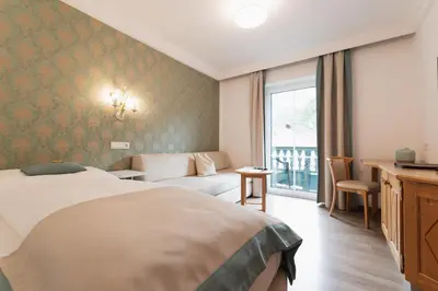 Ein Bett oder Betten in einem Zimmer der Unterkunft Gasthof Hotel Hauslwirt