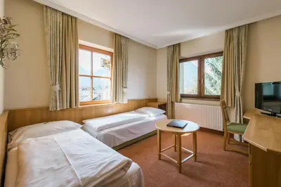 Ein Bett oder Betten in einem Zimmer der Unterkunft Gästehaus Reiter