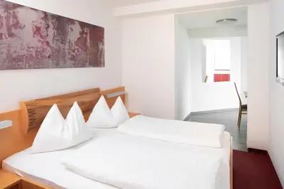 Ein Bett oder Betten in einem Zimmer der Unterkunft Sunshine Appartements Schilchegger