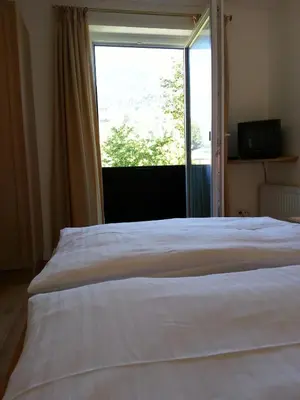Ein Bett oder Betten in einem Zimmer der Unterkunft Rupertihof