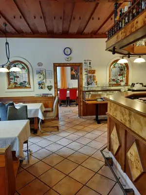 Ein Restaurant oder anderes Speiselokal in der Unterkunft Gästehaus zur Post - Heritage Inn