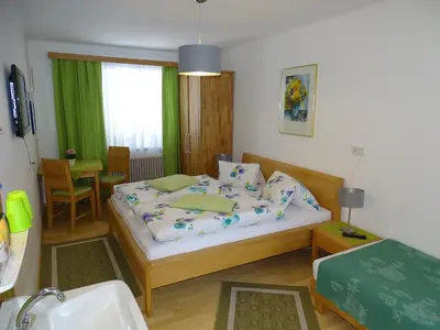 Ein Bett oder Betten in einem Zimmer der Unterkunft Pension Bayrhammer