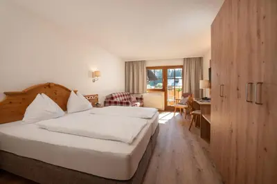 Ein Bett oder Betten in einem Zimmer der Unterkunft Hotel am Sonnenhügel