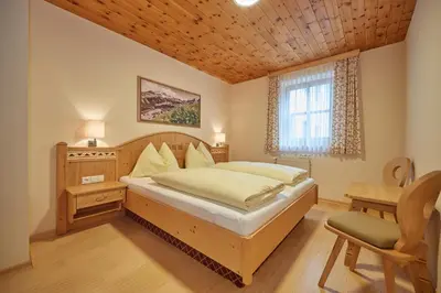 Ein Bett oder Betten in einem Zimmer der Unterkunft Hotel am Sonnenhügel