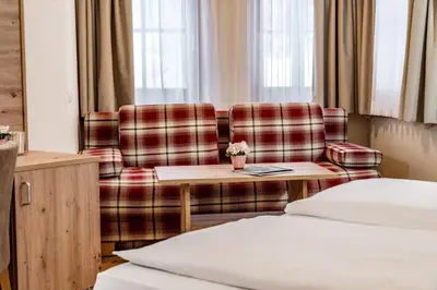 Ein Bett oder Betten in einem Zimmer der Unterkunft Hotel am Sonnenhügel