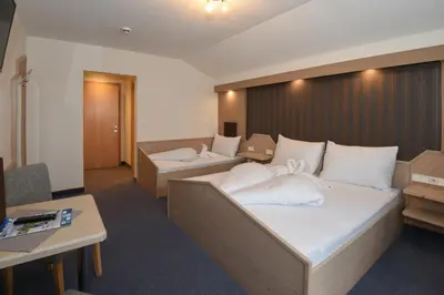 Ein Bett oder Betten in einem Zimmer der Unterkunft Golf & Skipension Krug