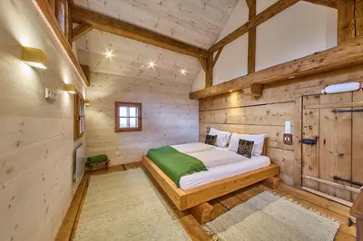Ein Bett oder Betten in einem Zimmer der Unterkunft Waldharmonie - Chalet & Apartments