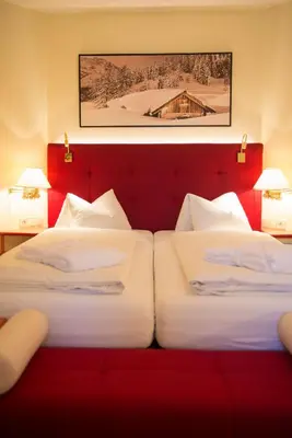 Ein Bett oder Betten in einem Zimmer der Unterkunft Hotel Zum Jungen Römer