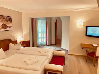 Ein Bett oder Betten in einem Zimmer der Unterkunft Hotel Zum Jungen Römer