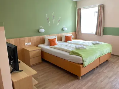Ein Bett oder Betten in einem Zimmer der Unterkunft Pension Göschlberger