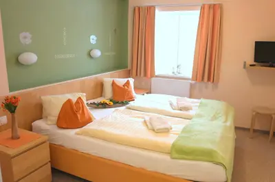 Ein Bett oder Betten in einem Zimmer der Unterkunft Pension Göschlberger