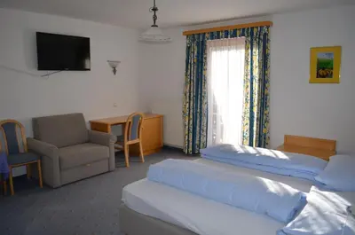 Ein Bett oder Betten in einem Zimmer der Unterkunft Gasthof Alte Tanne