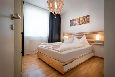 Ein Bett oder Betten in einem Zimmer der Unterkunft Appartmenthaus Martina by Schladming-Appartements